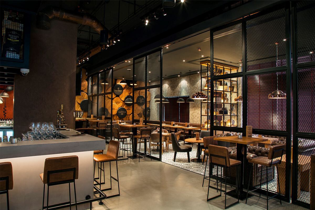 The Warehouse Grapes and Tapas Bar at Pearl Rotana Abu Dhabi interior dining and bar design